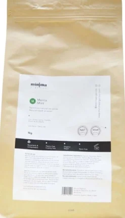Natürliches Zahnpulver mit Minze in kompostierbarer Papiertüte