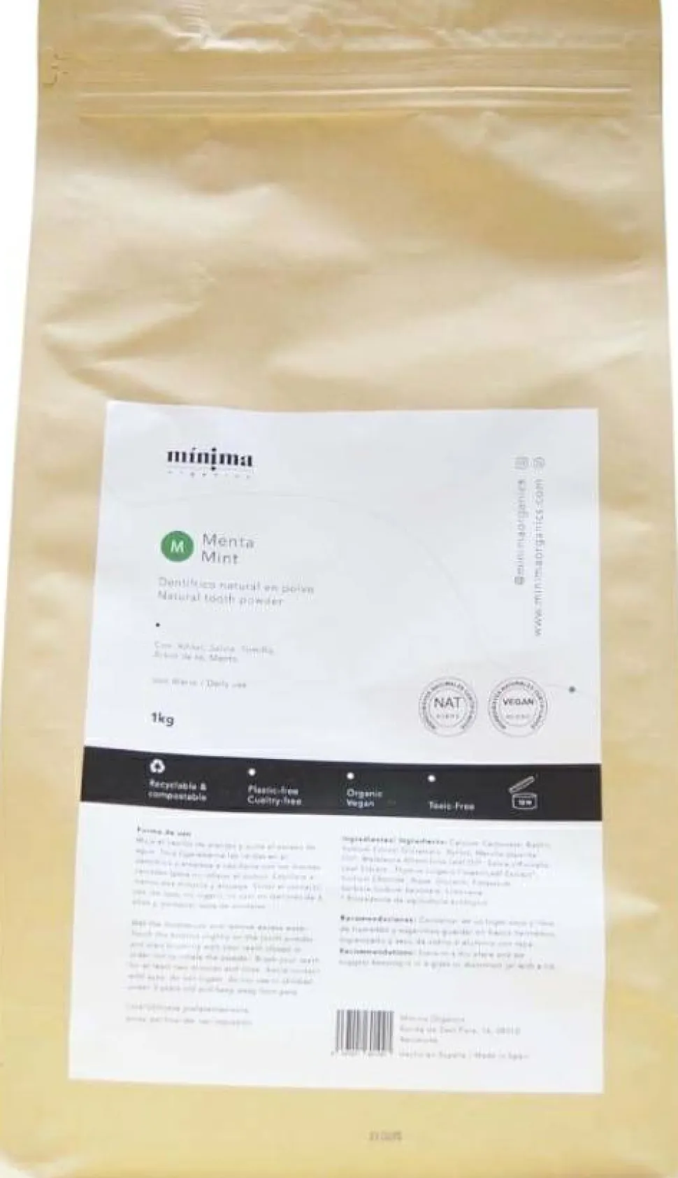 Natürliches Zahnpulver mit Minze in kompostierbarer Papiertüte