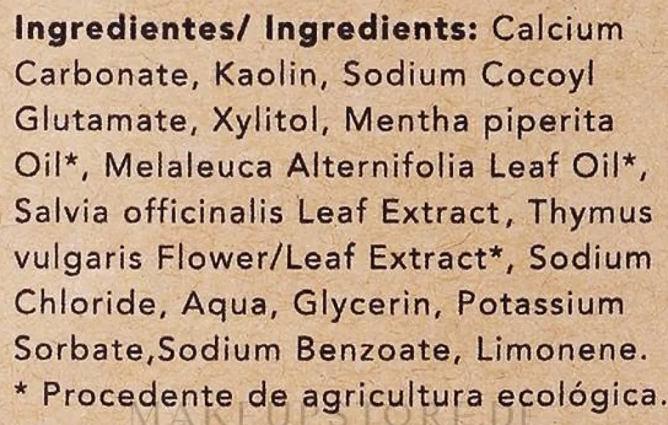 Natürliches Zahnpulver mit Minze in kompostierbarer Papiertüte